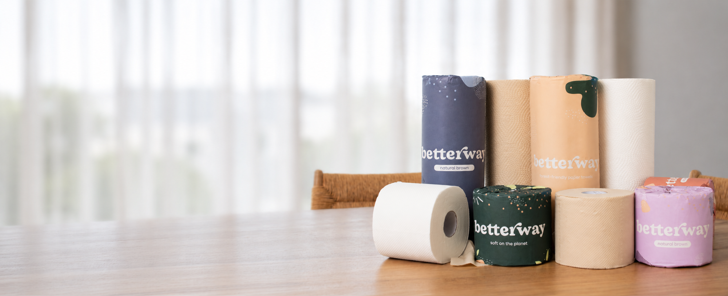 Betterway bamboo toilet paper and paper towels on a table